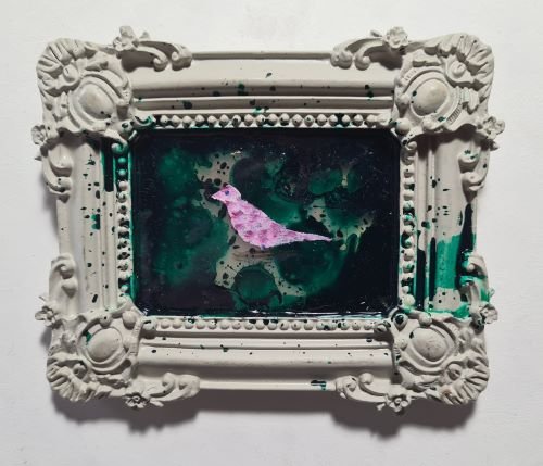 Pink bird on dark green